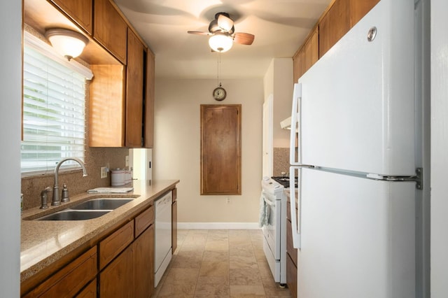 920 W 6th St, Madera, CA 93637 - kitchen featuring white appliances, brown cabinets, and a ceiling fan