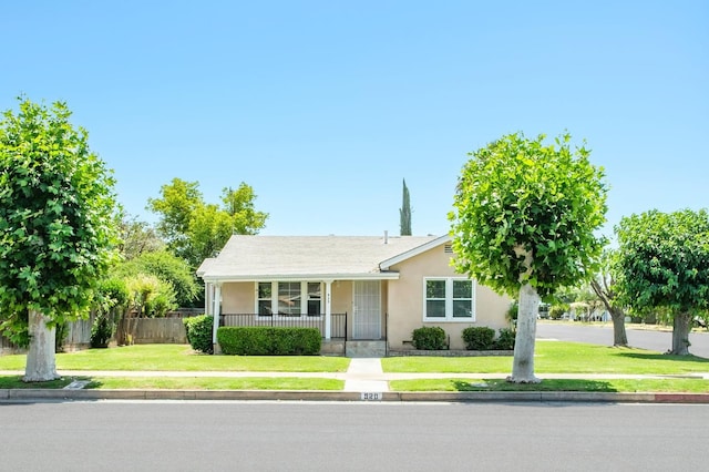 920 W 6th St, Madera, CA 93637 - view of front of home featuring stucco siding and a porch