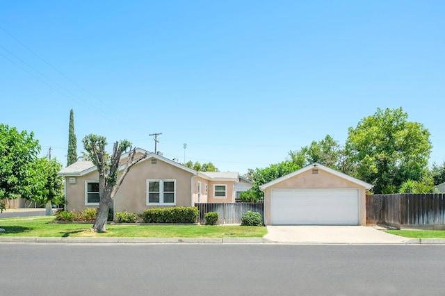 920 W 6th St, Madera, CA 93637 - single story home with stucco siding and a detached garage