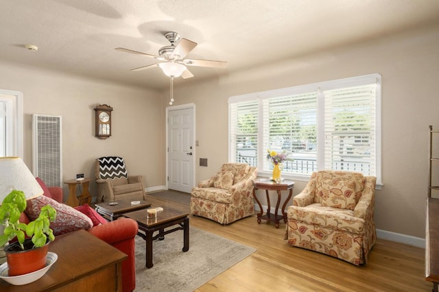 920 W 6th St, Madera, CA 93637 - living room with a heating unit, ceiling fan, and wood finished floors