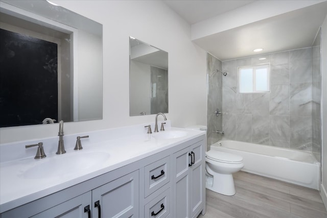 2012 E Clinton Ave, Fresno, CA 93703 - full bathroom featuring double vanity,  shower combination, and wood finished floors