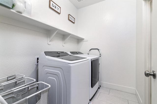 165 Timberline Way S, Madera, CA 93636 - washroom with independent washer and dryer and light tile patterned floors