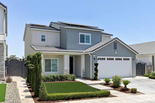 165 Timberline Way S, Madera, CA 93636 - traditional-style house with a gate, a garage, solar panels, and driveway