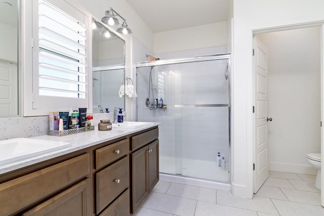 165 Timberline Way S, Madera, CA 93636 - bathroom featuring a shower stall, double vanity, and tile patterned flooring