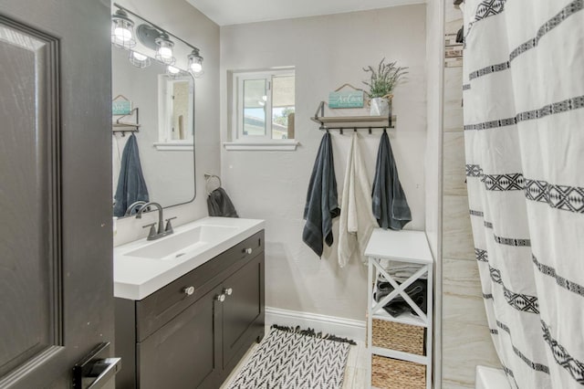 447 W Scott Ave, Clovis, CA 93612 - bathroom with vanity and baseboards