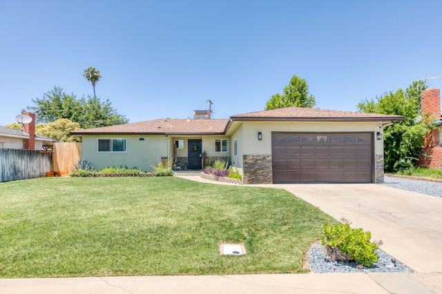 447 W Scott Ave, Clovis, CA 93612 - ranch-style home with a garage, concrete driveway, stucco siding, stone siding, and a chimney
