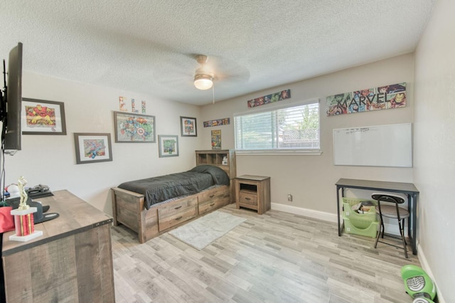 447 W Scott Ave, Clovis, CA 93612 - bedroom featuring light wood-style flooring, a textured ceiling, and ceiling fan