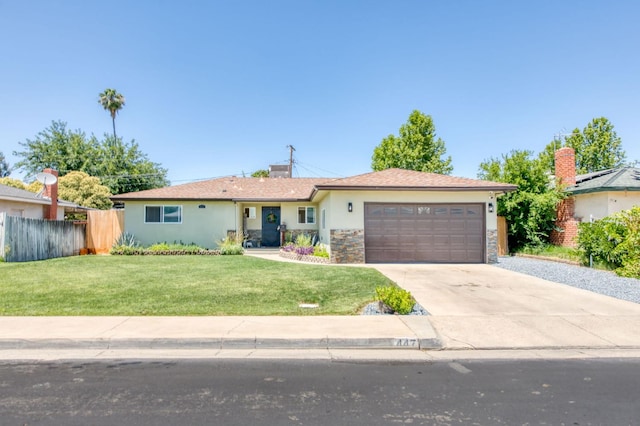 447 W Scott Ave, Clovis, CA 93612 - ranch-style house with a garage, concrete driveway, stucco siding, and stone siding