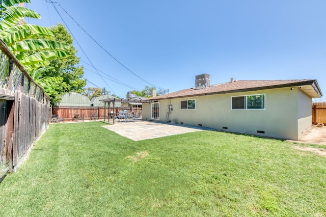 447 W Scott Ave, Clovis, CA 93612 - back of house featuring crawl space, a fenced backyard, a patio area, and stucco siding