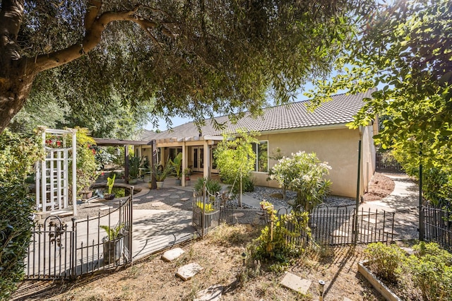 3624 N Jackie, Visalia, CA 93291 - back of property featuring stucco siding, a patio, and a tiled roof