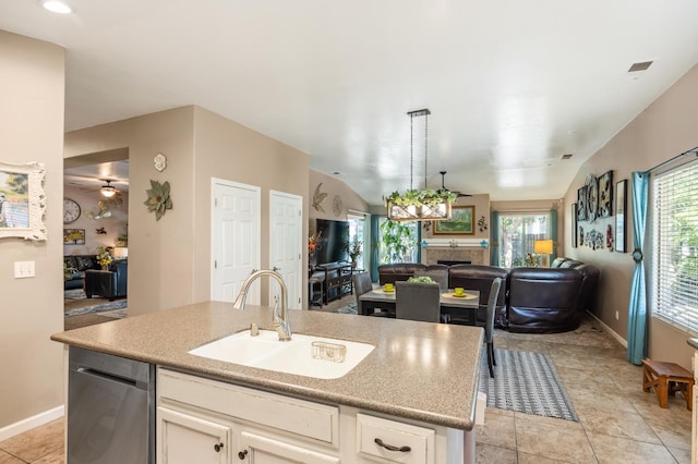 3624 N Jackie, Visalia, CA 93291 - kitchen with open floor plan, stainless steel dishwasher, an island with sink, pendant lighting, and a fireplace