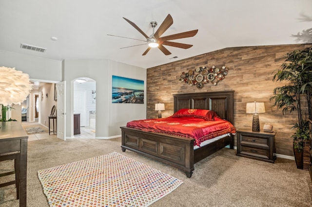 3624 N Jackie, Visalia, CA 93291 - carpeted bedroom with arched walkways, lofted ceiling, connected bathroom, ceiling fan, and wood walls