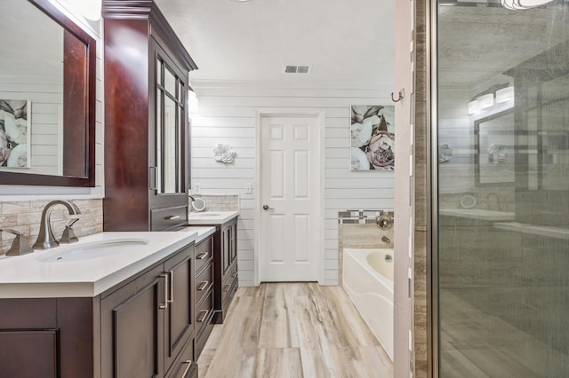 3624 N Jackie, Visalia, CA 93291 - full bathroom featuring vanity, a bath, a stall shower, and wood finished floors
