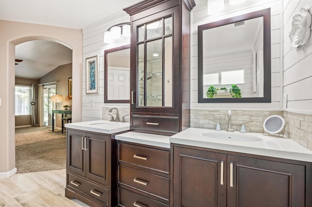 3624 N Jackie, Visalia, CA 93291 - full bath with two vanities, tasteful backsplash, vaulted ceiling, and wood finished floors