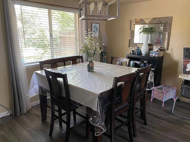 3462 W Wrenwood Ave, Fresno, CA 93711 - dining room featuring dark wood-style flooring and baseboards