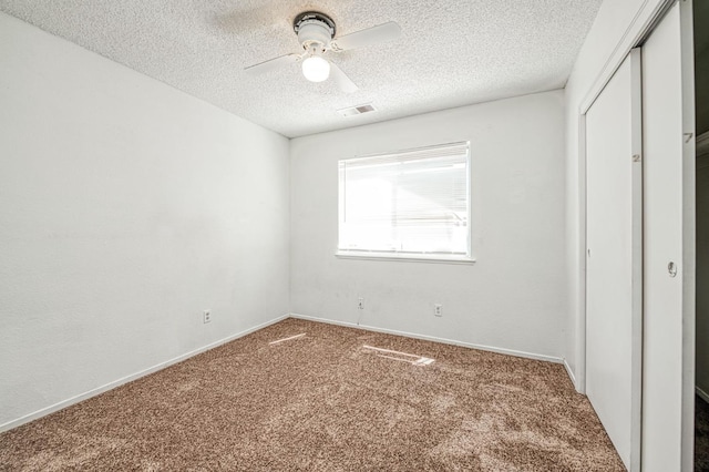 3340 N Dante Ave, Fresno, CA 93722 - unfurnished bedroom featuring carpet floors, a textured ceiling, a closet, and a ceiling fan