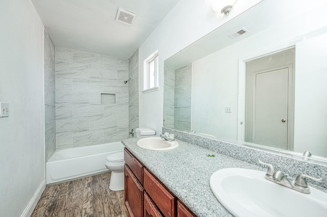 3340 N Dante Ave, Fresno, CA 93722 - bathroom with double vanity, wood finished floors, and bathing tub / shower combination