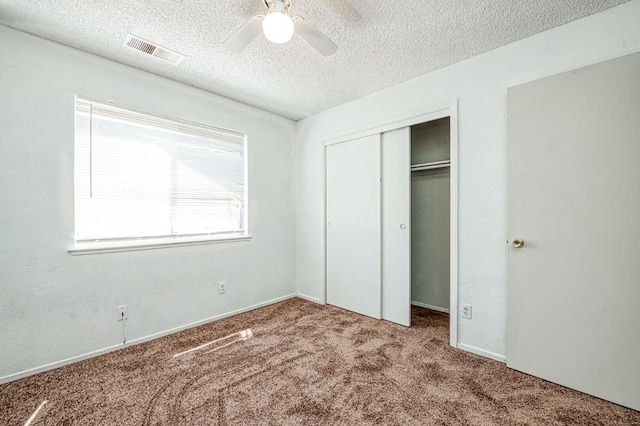 3340 N Dante Ave, Fresno, CA 93722 - unfurnished bedroom with carpet, a textured ceiling, a closet, and ceiling fan