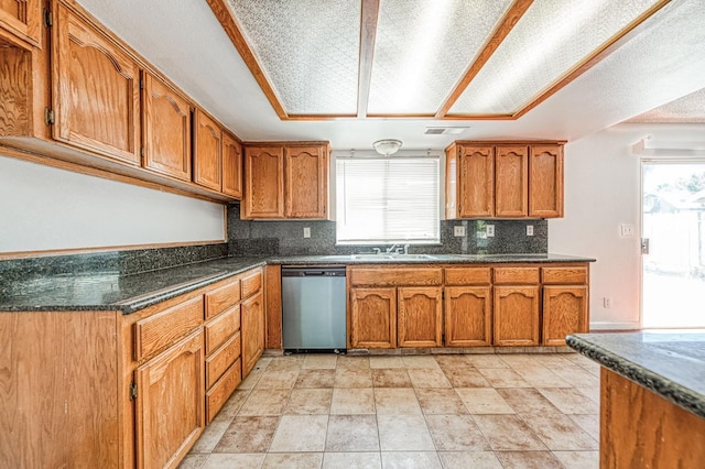 3340 N Dante Ave, Fresno, CA 93722 - kitchen featuring stainless steel dishwasher, brown cabinets, backsplash, and light stone finish floors