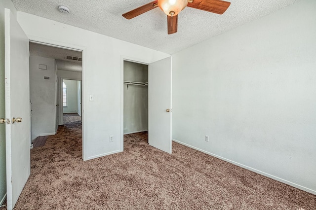 3340 N Dante Ave, Fresno, CA 93722 - unfurnished bedroom featuring carpet flooring, a textured ceiling, a closet, and ceiling fan