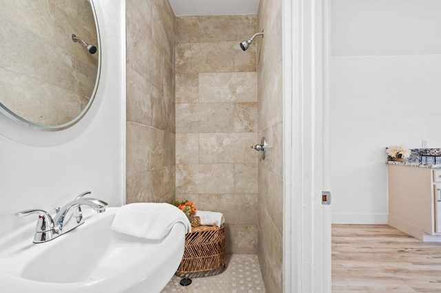 1022 N Carruth Ave, Fresno, CA 93728 - full bathroom with tiled shower and wood finished floors