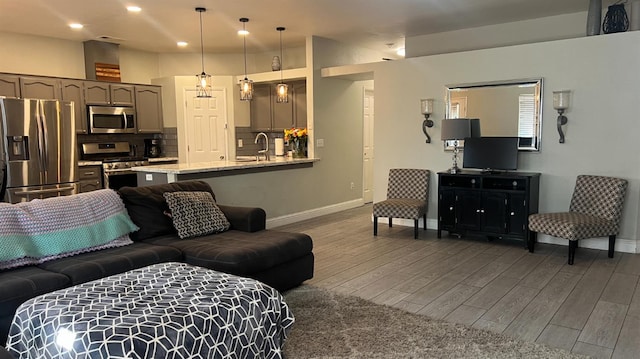 2434 Cherrywood Ct, Hanford, CA 93230 - living room featuring wood finished floors and recessed lighting