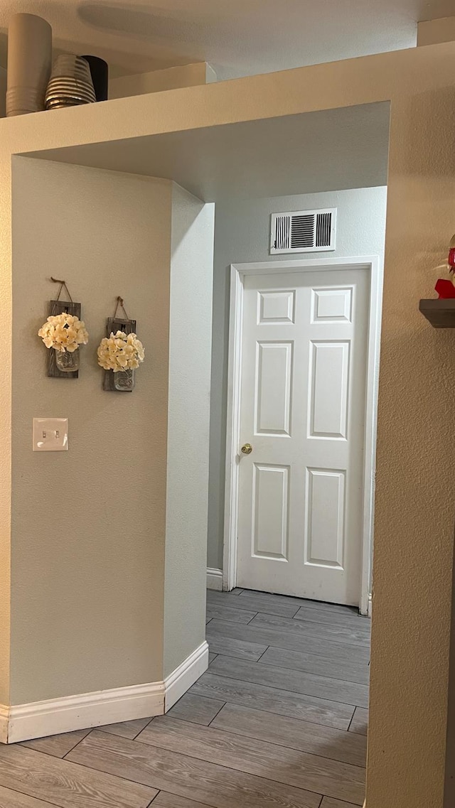 2434 Cherrywood Ct, Hanford, CA 93230 - corridor featuring wood finished floors and baseboards