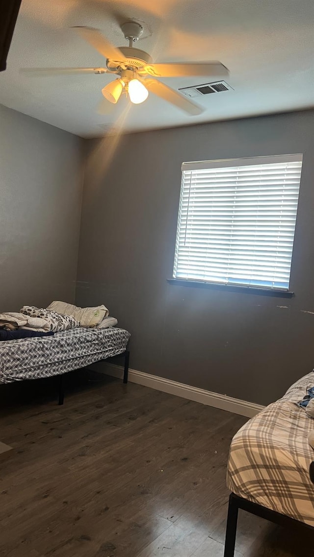 2434 Cherrywood Ct, Hanford, CA 93230 - bedroom featuring dark wood-type flooring and ceiling fan