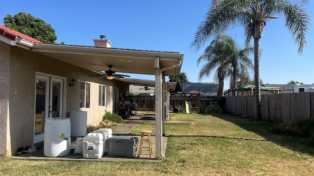 2434 Cherrywood Ct, Hanford, CA 93230 - fenced yard featuring ceiling fan