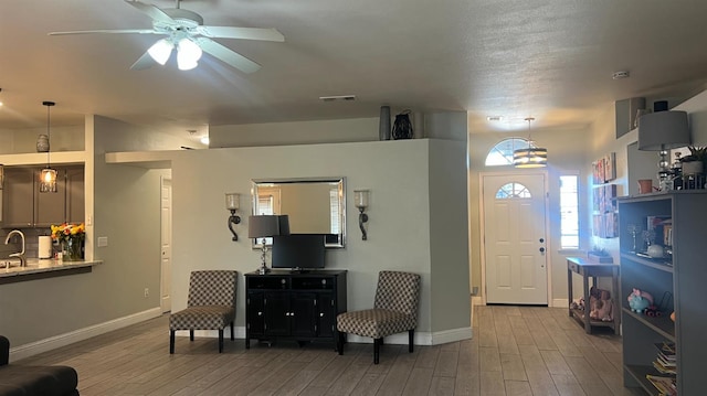 2434 Cherrywood Ct, Hanford, CA 93230 - living area with wood finished floors and a ceiling fan