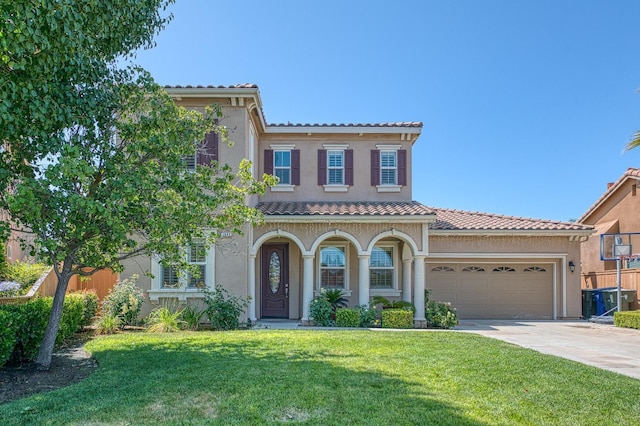 2593 E Utah, Fresno, CA 93720 - mediterranean / spanish-style home featuring a tiled roof, stucco siding, concrete driveway, and a garage
