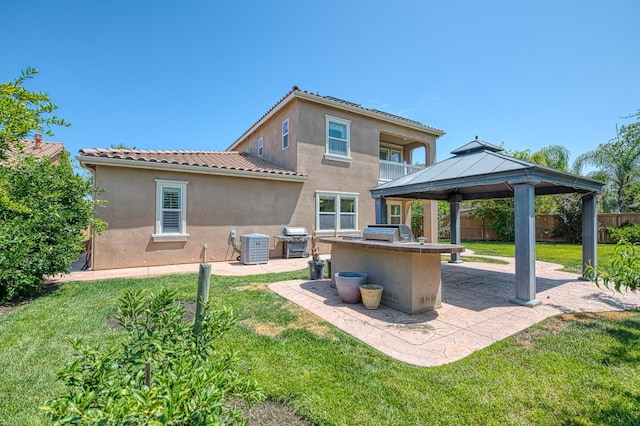 2593 E Utah, Fresno, CA 93720 - back of property featuring a patio, stucco siding, and an outdoor kitchen