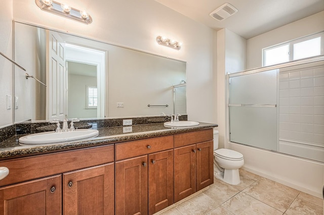 2593 E Utah, Fresno, CA 93720 - full bathroom featuring double vanity, enclosed tub / shower combo, and tile patterned floors