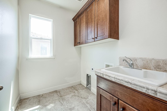 2593 E Utah, Fresno, CA 93720 - laundry area with cabinet space, hookup for an electric dryer, and hookup for a washing machine