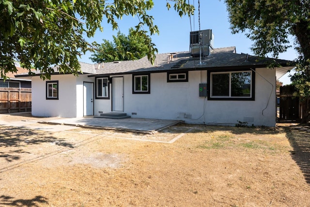 1934 W Pontiac Way, Fresno, CA 93705 - back of house with stucco siding, a patio, and a shingled roof