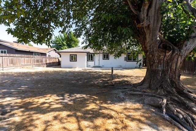 1934 W Pontiac Way, Fresno, CA 93705 - view of front of house featuring stucco siding and a fenced backyard