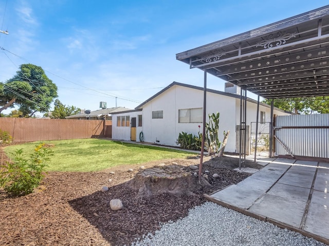 4326 N Holt, Fresno, CA 93705 - back of house featuring a gate and stucco siding