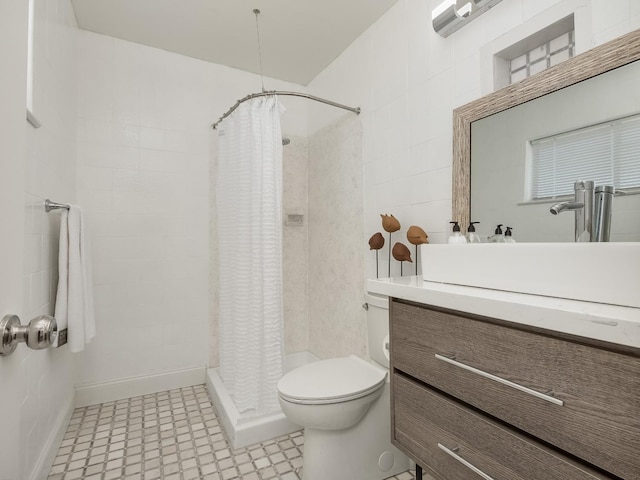 4326 N Holt, Fresno, CA 93705 - full bathroom with tile patterned floors, vanity, a stall shower, and tile walls