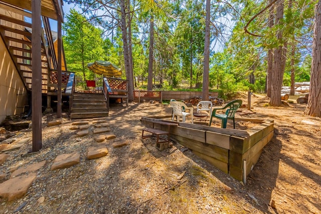 53608 Chipo Poyah, North Fork, CA 93643 - view of yard featuring stairway, a wooden deck, and view of scattered trees