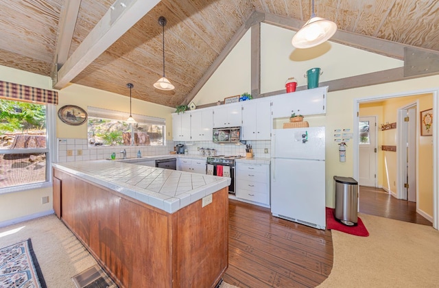 53608 Chipo Poyah, North Fork, CA 93643 - kitchen featuring appliances with stainless steel finishes, a peninsula, white cabinets, tasteful backsplash, and wooden ceiling
