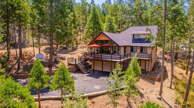 53608 Chipo Poyah, North Fork, CA 93643 - rear view of house featuring stairs, a deck, an attached garage, asphalt driveway, and roof with shingles
