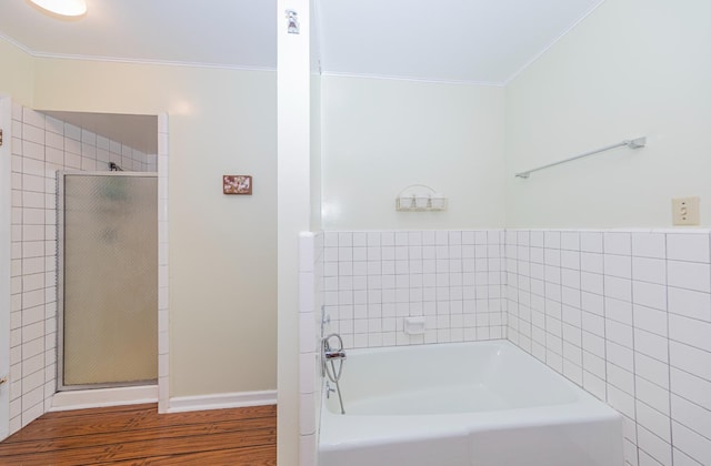 53608 Chipo Poyah, North Fork, CA 93643 - full bathroom with crown molding, a bath, a stall shower, and wood finished floors