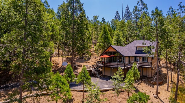 53608 Chipo Poyah, North Fork, CA 93643 - back of house featuring a wooden deck, stairs, a patio area, an attached garage, and roof with shingles