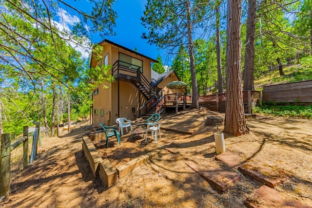 53608 Chipo Poyah, North Fork, CA 93643 - back of house with stairs, a wooden deck, and an outdoor fire pit