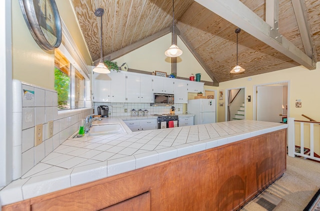 53608 Chipo Poyah, North Fork, CA 93643 - kitchen with electric stove, freestanding refrigerator, a peninsula, tile countertops, and wooden ceiling