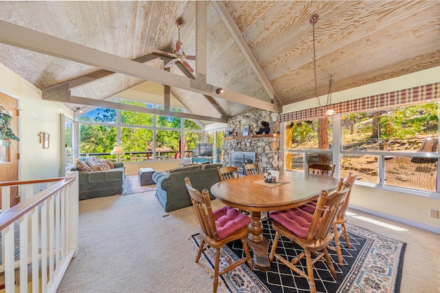 53608 Chipo Poyah, North Fork, CA 93643 - carpeted dining area with healthy amount of natural light, a stone fireplace, and a ceiling fan