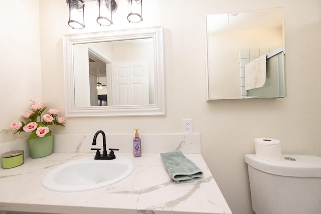 5263 W Griffith Way, Fresno, CA 93722 - bathroom featuring toilet and vanity