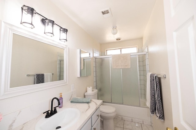 5263 W Griffith Way, Fresno, CA 93722 - bathroom featuring vanity and bath / shower combo with glass door
