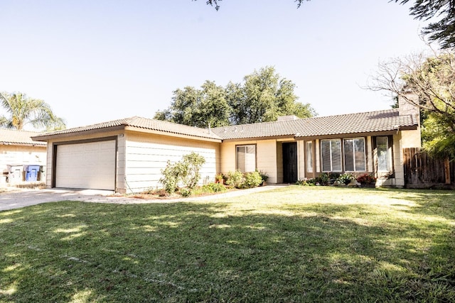 5263 W Griffith Way, Fresno, CA 93722 - ranch-style home with a garage, a tiled roof, a front lawn, and a chimney