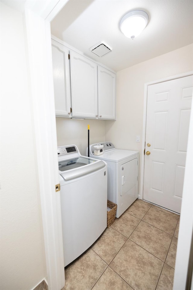 5263 W Griffith Way, Fresno, CA 93722 - laundry area featuring cabinet space, separate washer and dryer, and light tile patterned floors